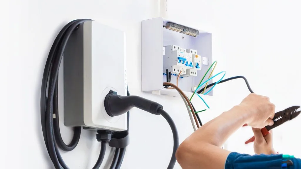 Residential electrician Calgary inspecting home electrical panel safely